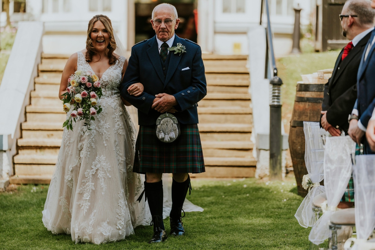 Bride and Dad walking down the aisle at Dunkeld House