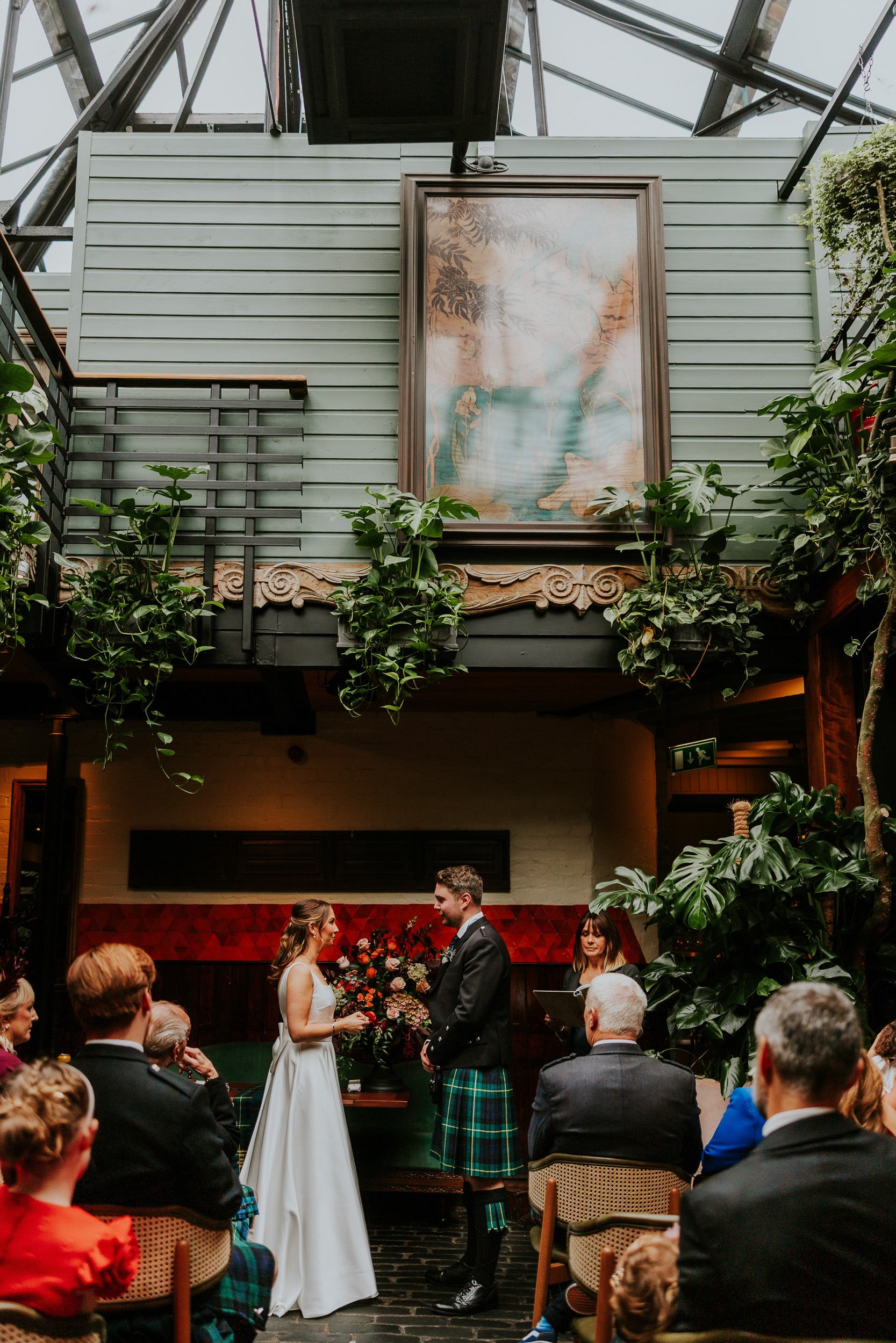 Wedding ceremony at Ubiquitous Chip in Glasgow conducted by Carol Smillie