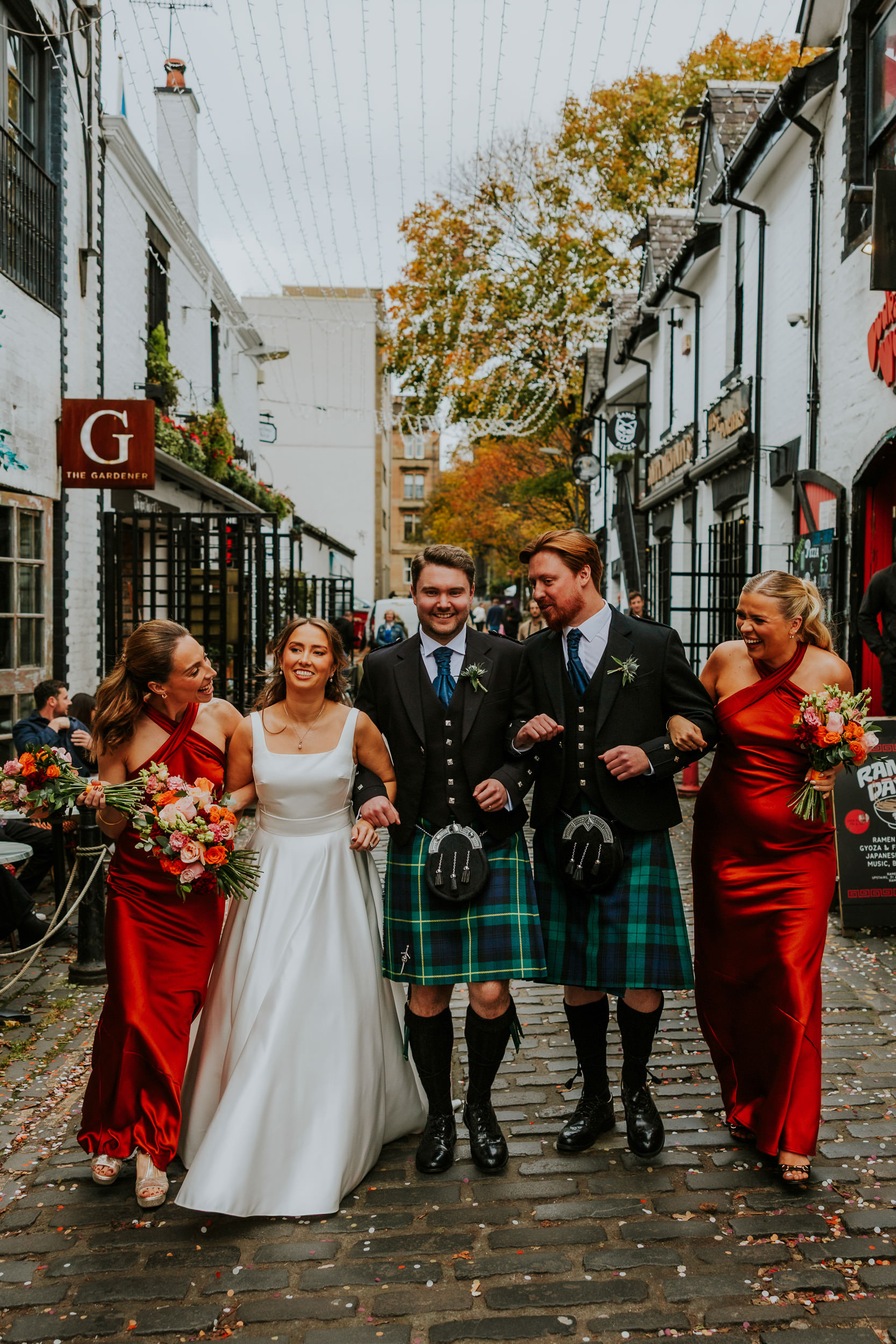 Bridal party walking through Ashton Lane at Ubiquitous Chip wedding