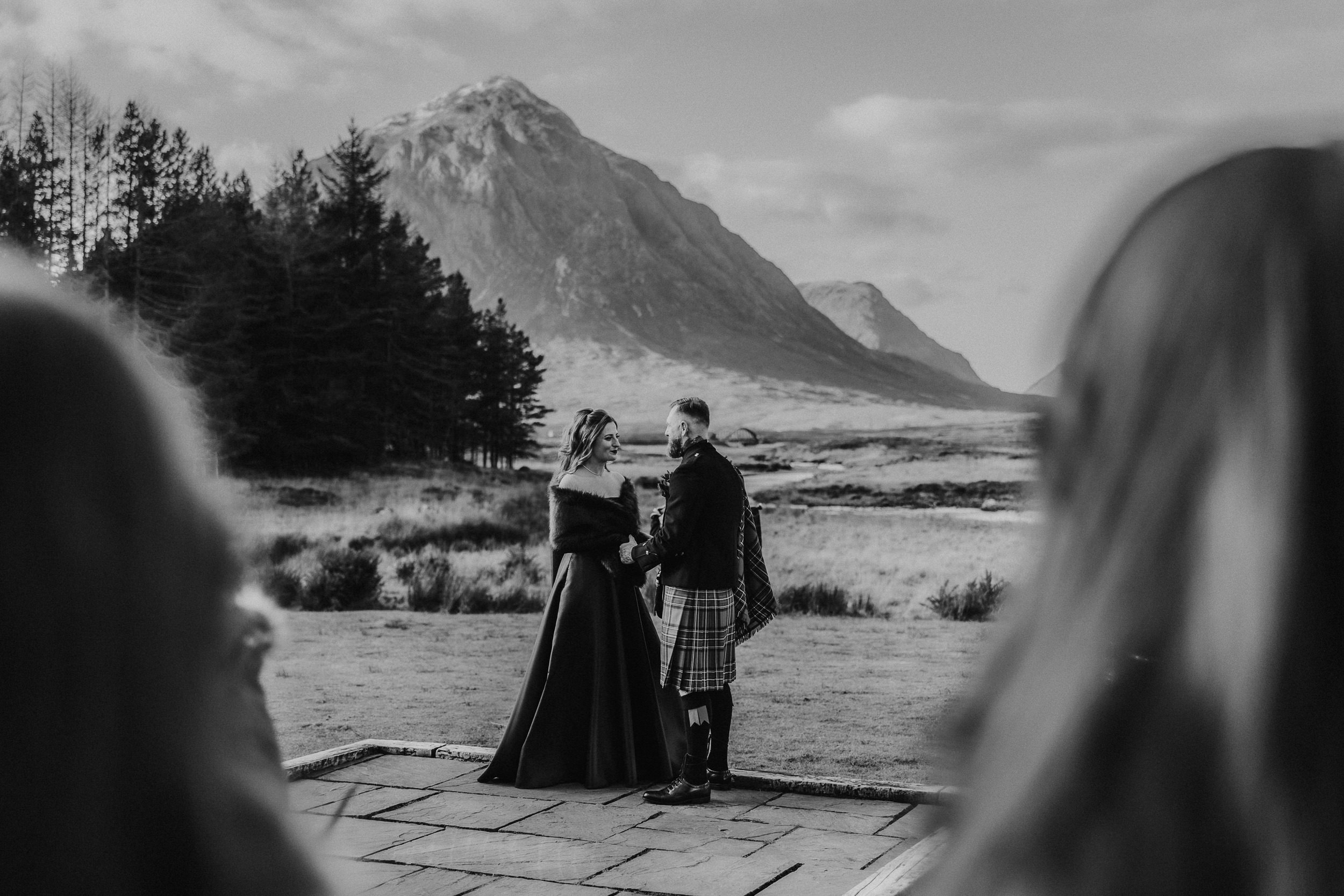 Bride and Groom getting married outdoors at the Kingshouse Hotel 