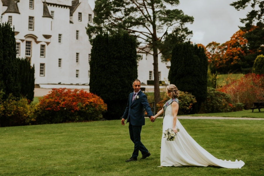 Bride and Groom walking through Blair Castle grounds