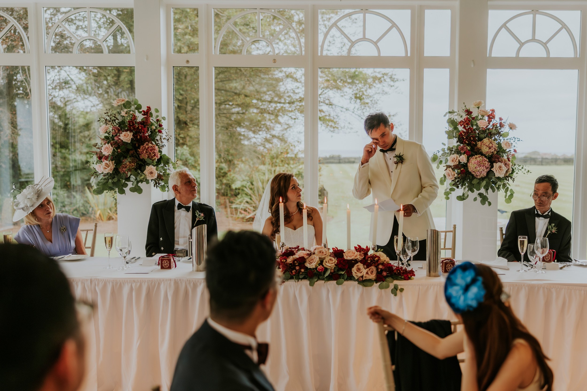 Gordon wipes his eye during his speech as Emma watches from the top table at Lochgreen House Hotel.