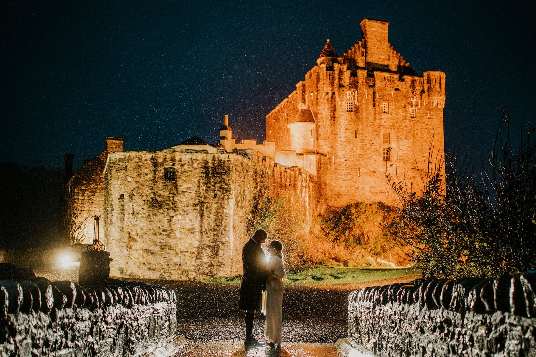 Eilean Donan Castle at night in the rain