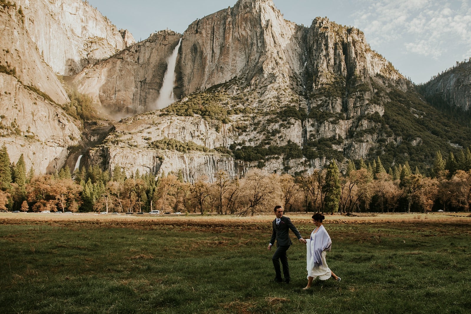 Bride and Groom walking through Yosemite park