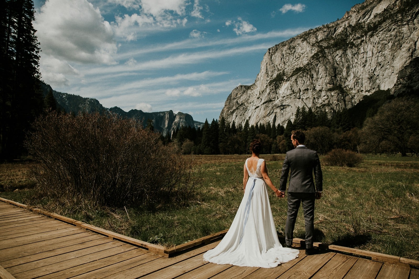 bride and groom looking out to yosemite park